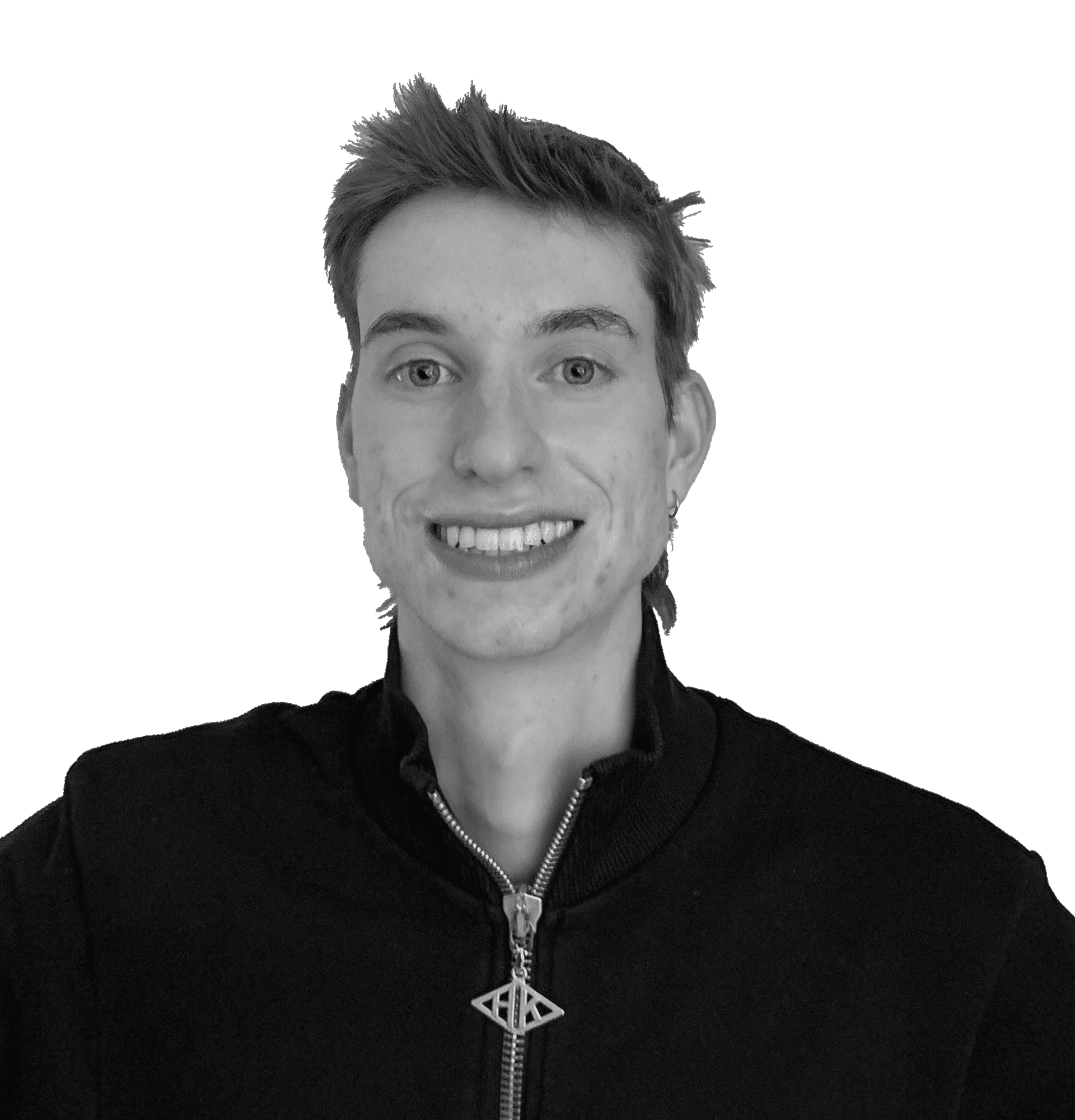 Greyscaled portrait image of man smiling directly into the camera.